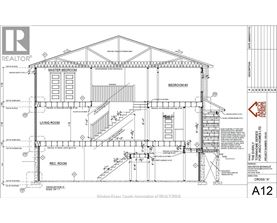 A drawing of a house with a living room, master bedroom, and other rooms.