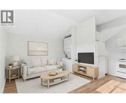 A living room with a couch, coffee table, and television.