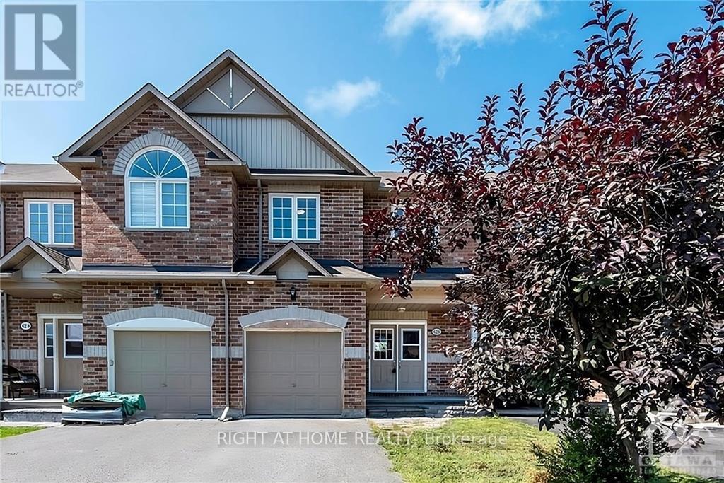 A house with a brick facade and a large front yard.