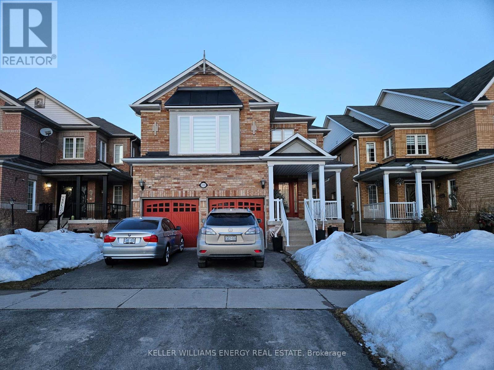 A house with a car parked in front of it.