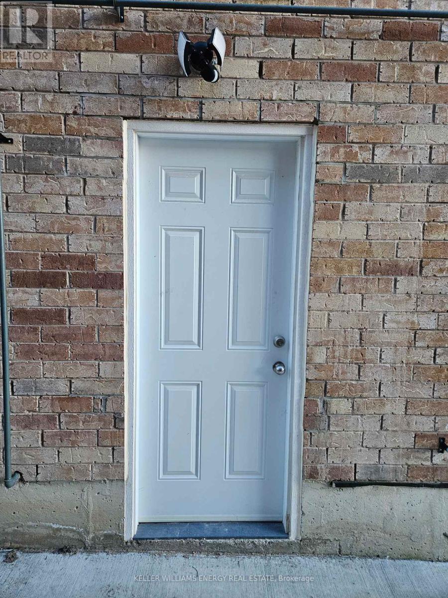 A white door with a mailbox on the wall.