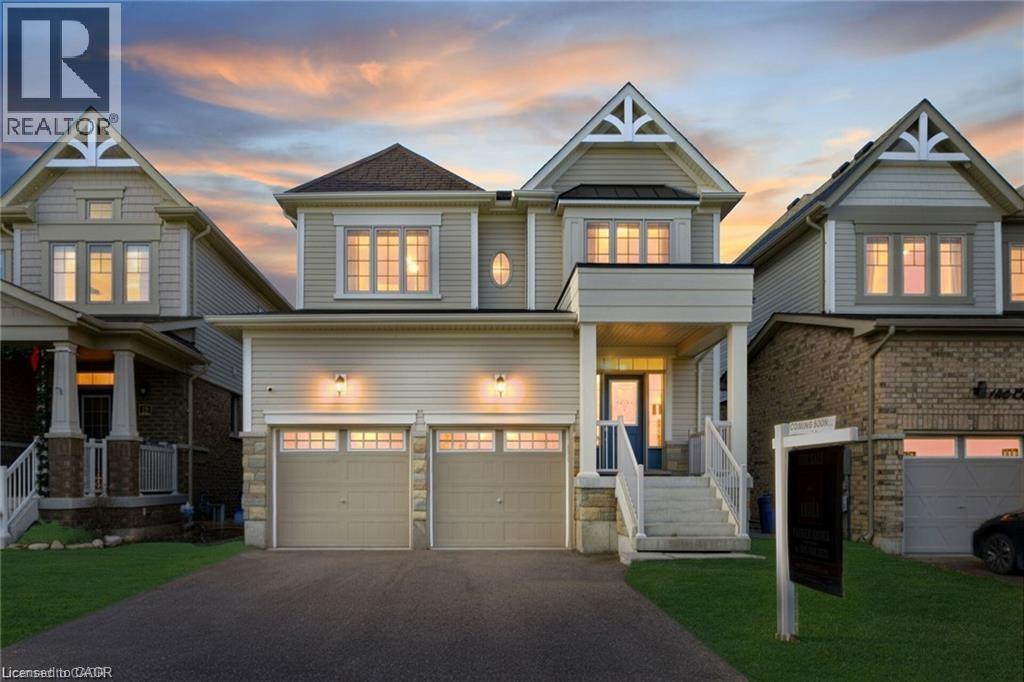 A large, well-lit house with a garage is shown in the image.