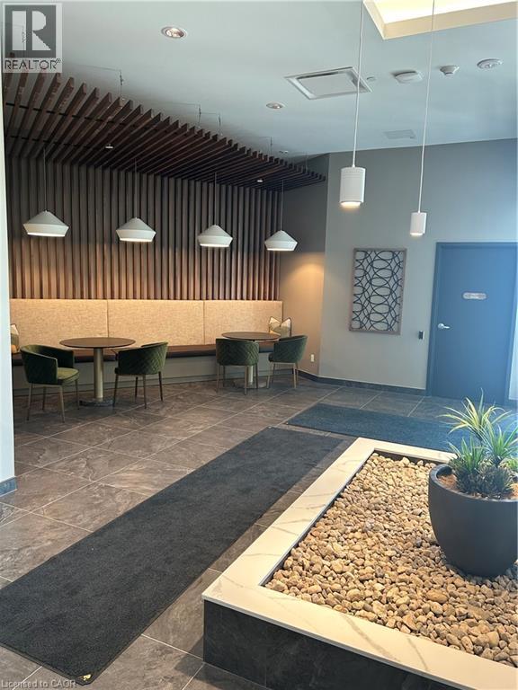 A modern dining area with a long table and chairs.