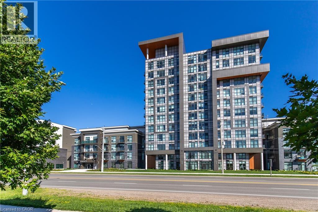 A modern multi-story building with a glass facade and a brown wooden accent.