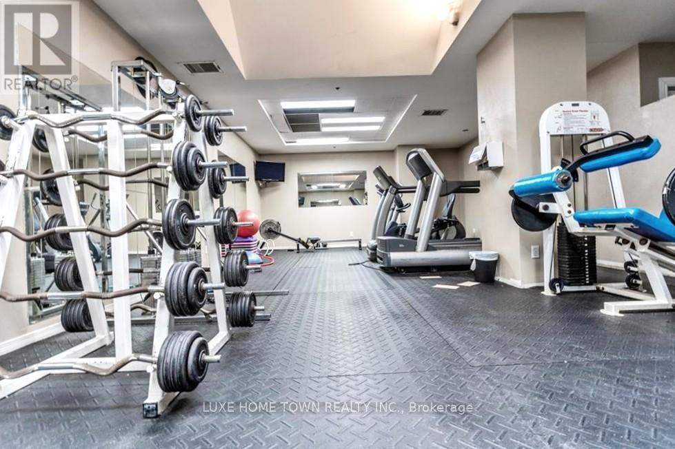 A well-equipped gym with a variety of exercise machines and weightlifting equipment.