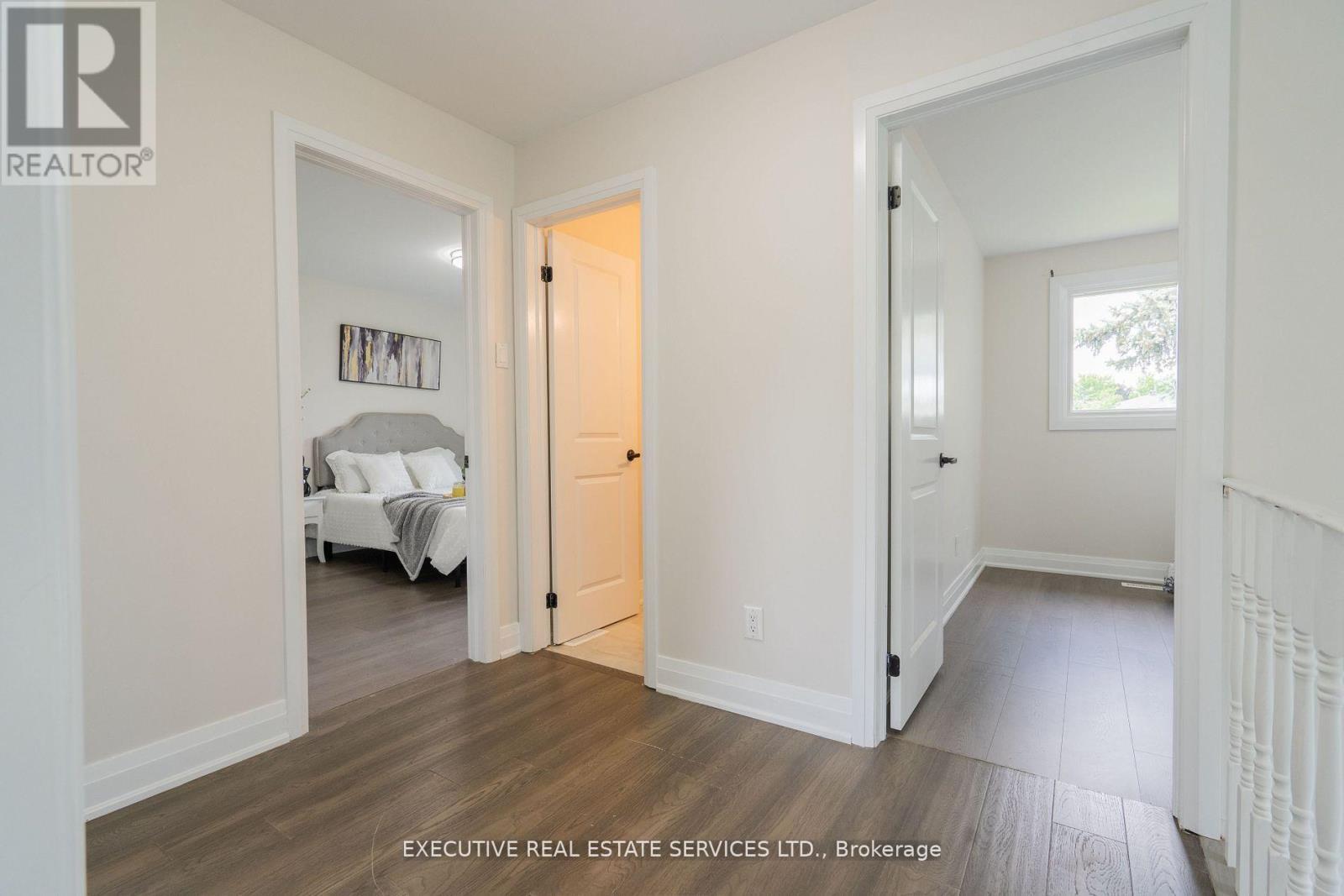 A bedroom with a bed and a dresser in it.
