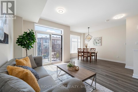 A living room with a grey couch and a coffee table.