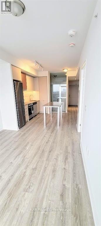 A room with a wooden floor and a white ceiling.