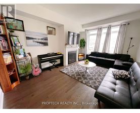 A living room with a fireplace and a guitar.