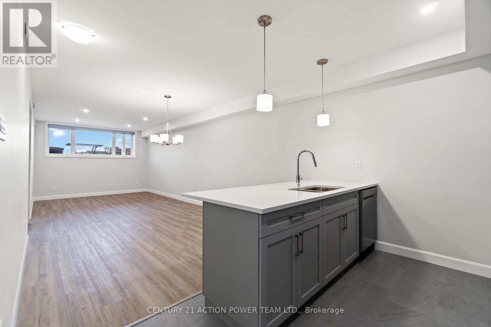 A kitchen with a sink and cabinets.