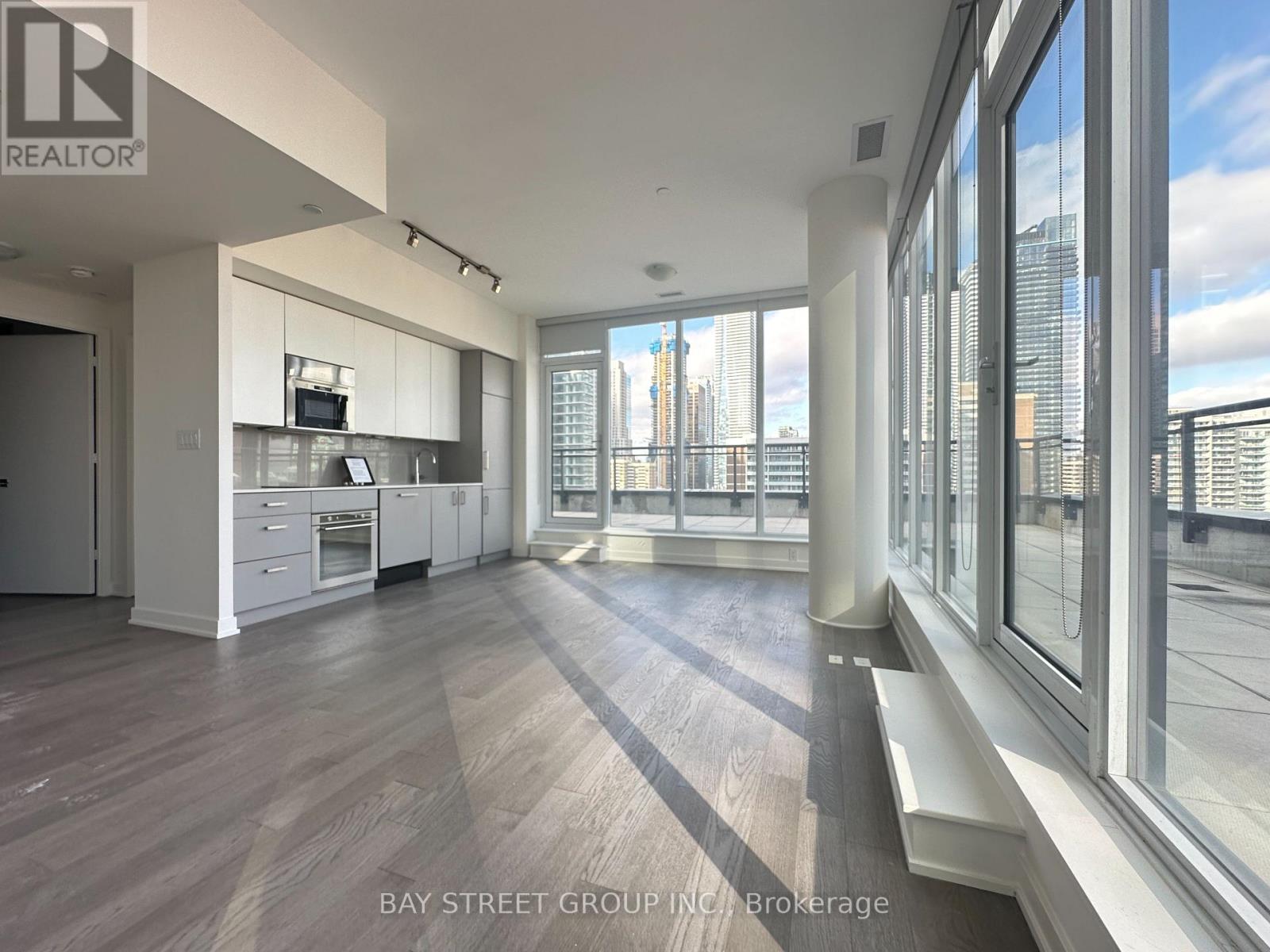 A spacious kitchen with a view of the city.