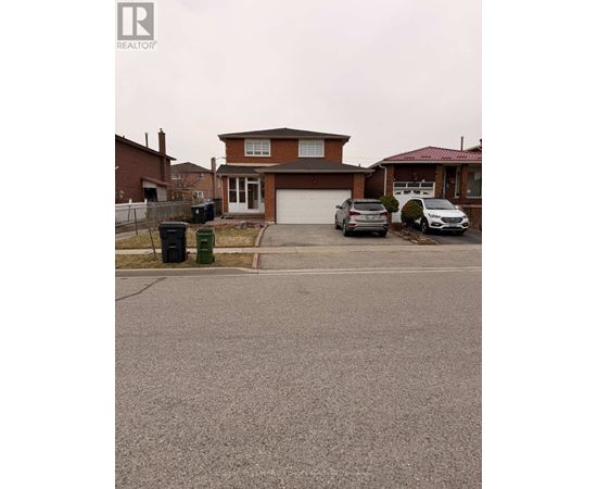 A house with a brown roof and a driveway in front of it.
