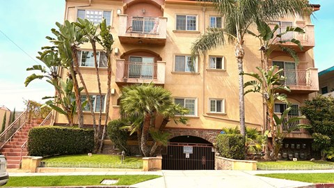 A building with a black gate in front of it.
