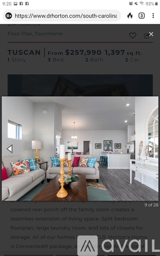 A living room with a couch, a lamp, and a coffee table.