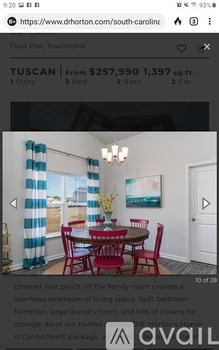 A dining room with a table set for four.