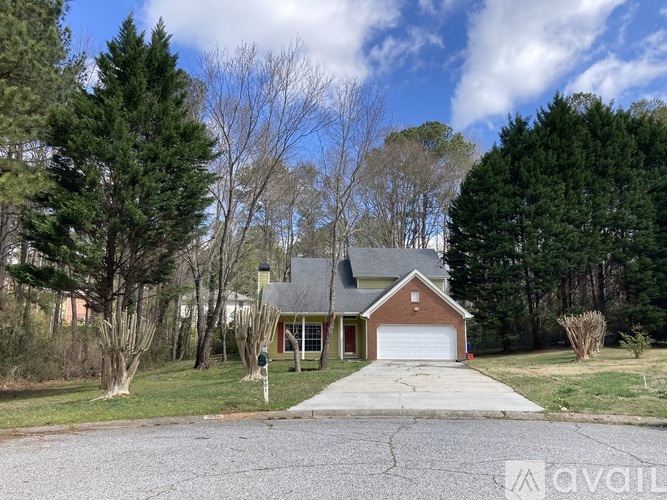 A house with a driveway in front of it.