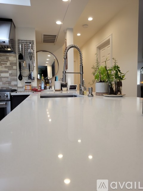 A modern kitchen with a large island in the center.