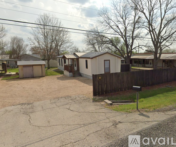 A row of houses with a mailbox in the foreground.