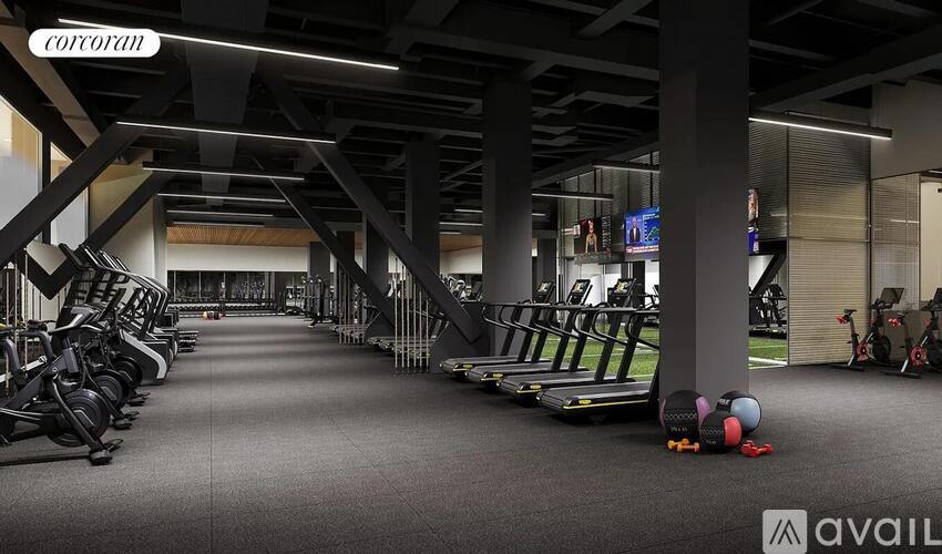 A gym with treadmills, exercise bikes, and other equipment.