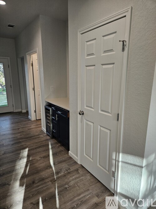 A white door is on the right side of the image.