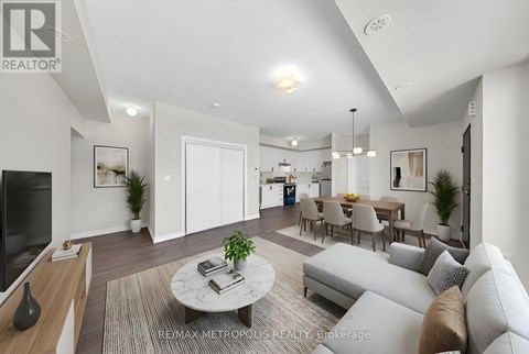A well-lit, modern living room with a grey sofa and a coffee table.