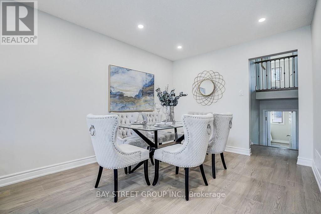A dining room with a table set for four.