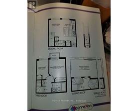 A booklet shows floor plans for a house with two bedrooms, a master bedroom, and a terrace.