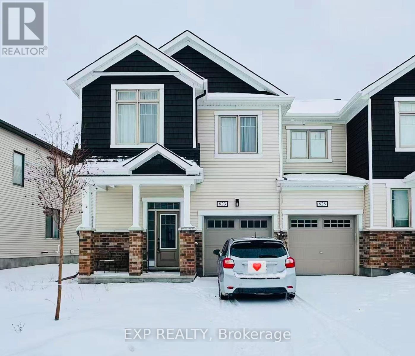 A house with a car parked in front of it.