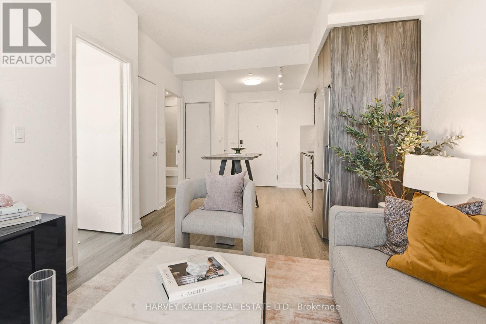 A living room with a grey couch and a coffee table.
