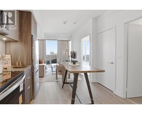 A modern kitchen with a dining table and chairs.