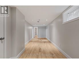 A long hallway with EXP REALTY, Brokerage written on the bottom.
