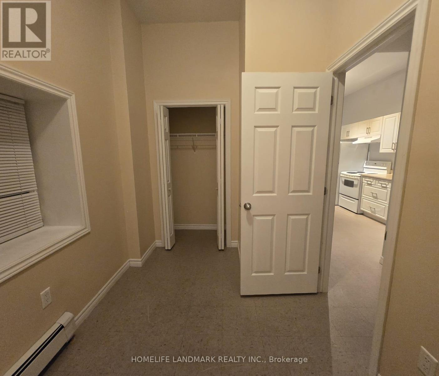 A room with a doorway leading to another room.