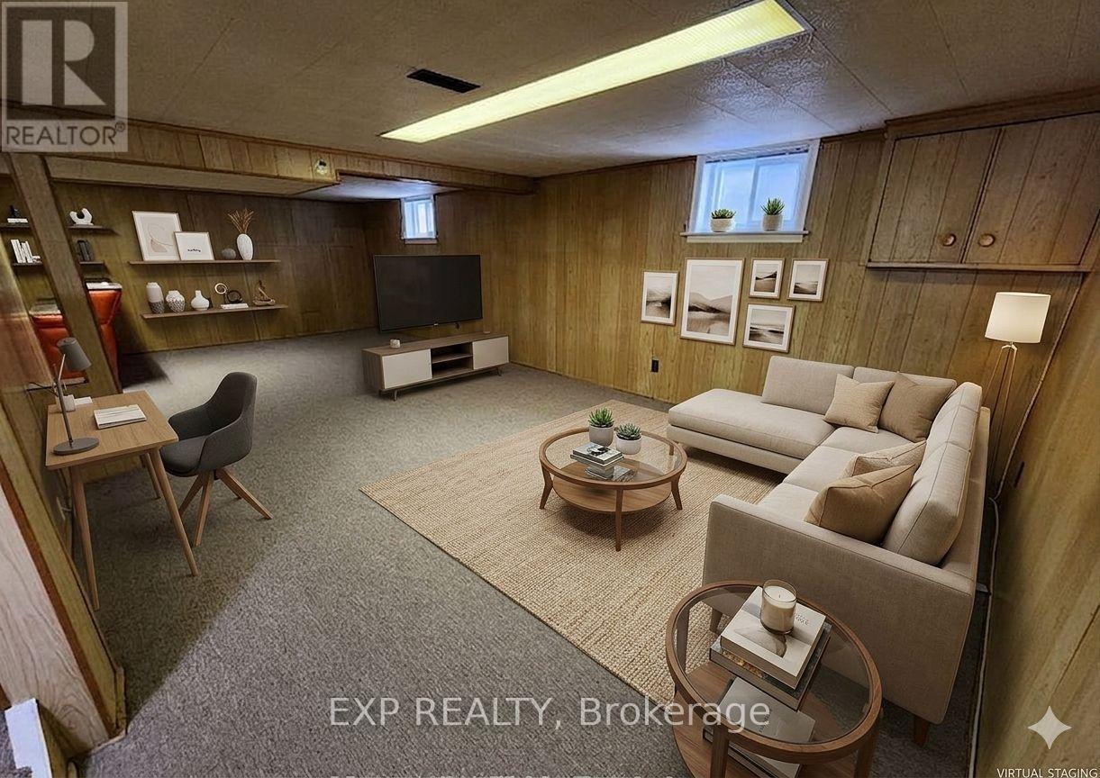 A living room with a couch, chair, and television.