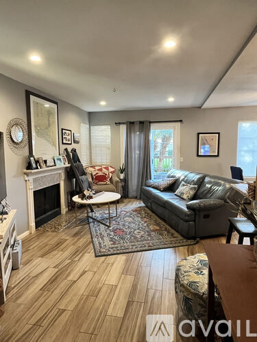A living room with a fireplace and a couch.