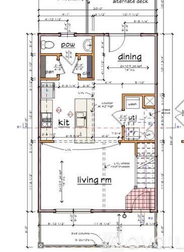 A floor plan of a living space with a kitchen, dining area, and bathroom.