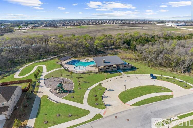 A park with a playground and a swimming pool.