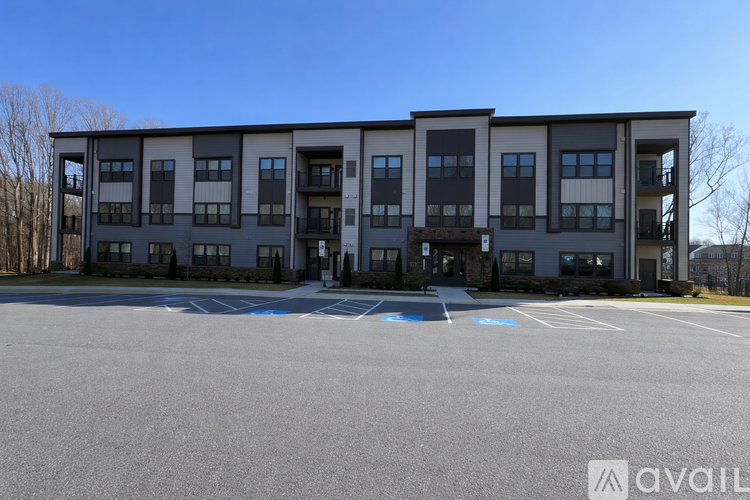 A large building with a parking lot in front of it.
