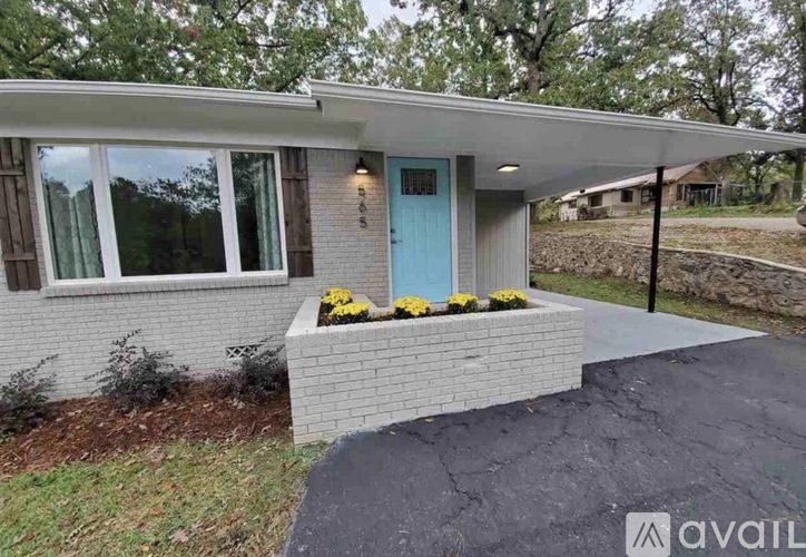 A house with a blue door and a small porch.