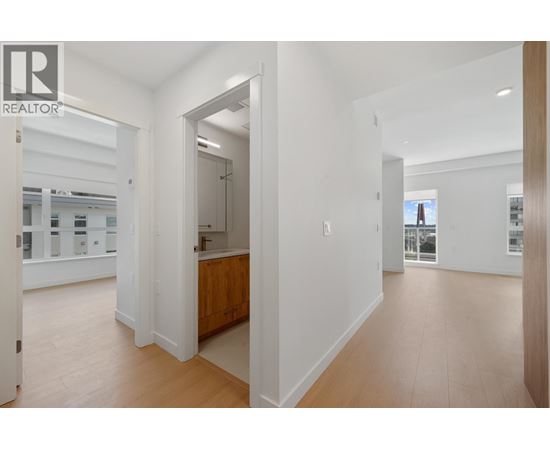 A realtor logo is on the top left of a white interior space.