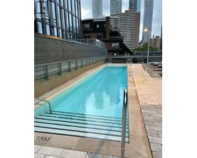 A swimming pool on a rooftop with a 15M marker.