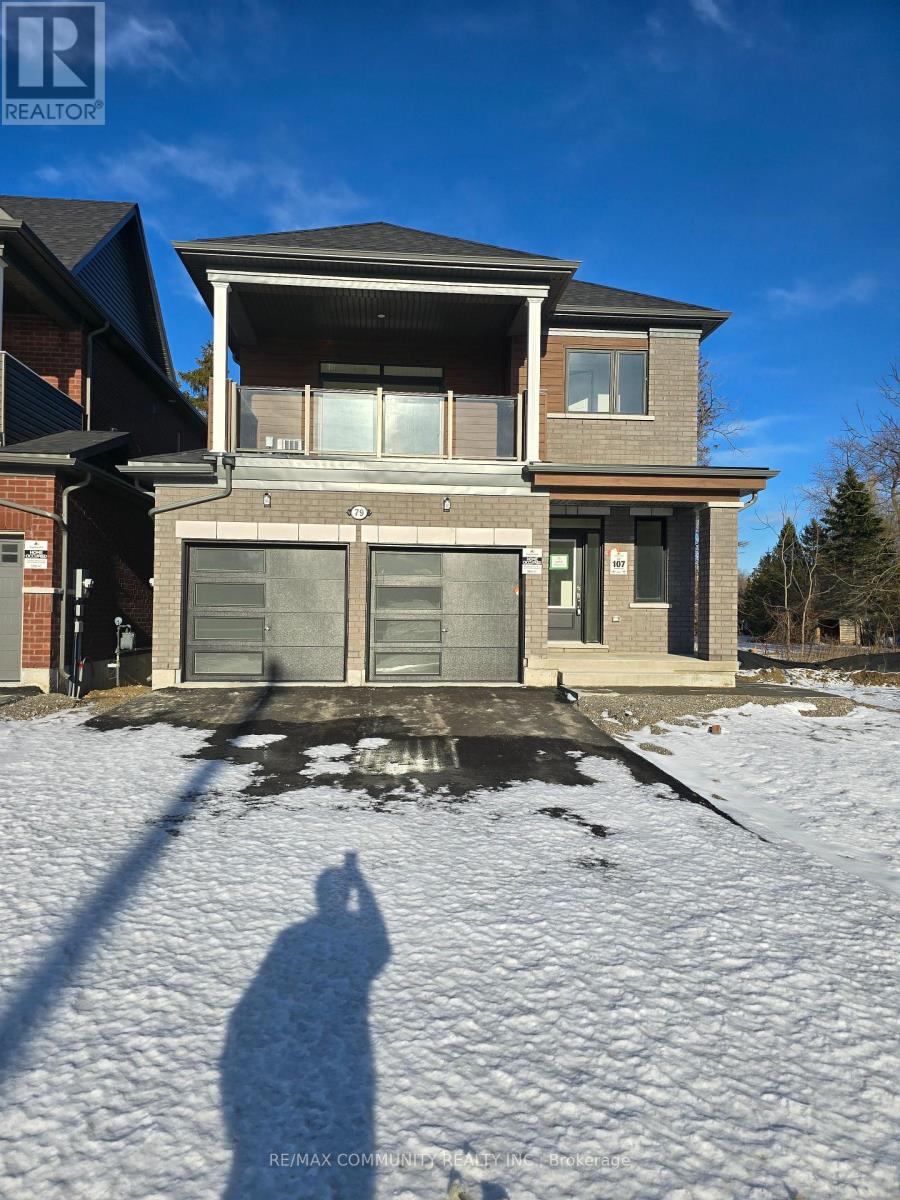 A house with a snow-covered ground in front of it.