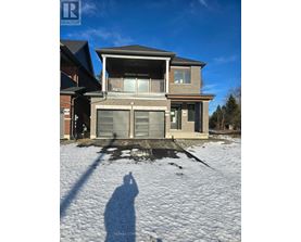 A house with a snow-covered ground in front of it.