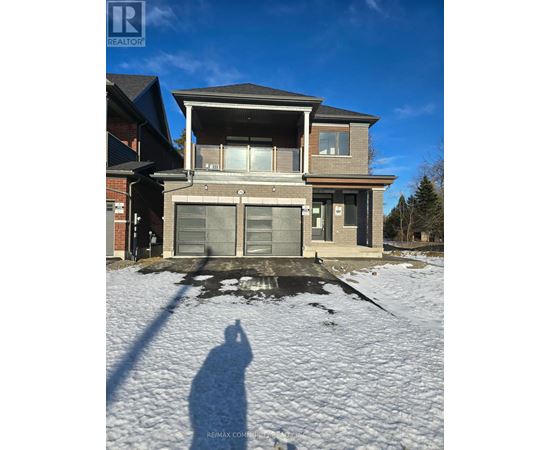 A house with a snow-covered ground in front of it.