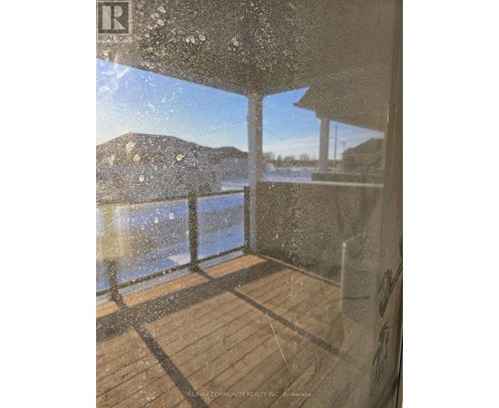 A view from a window of a snowy landscape.