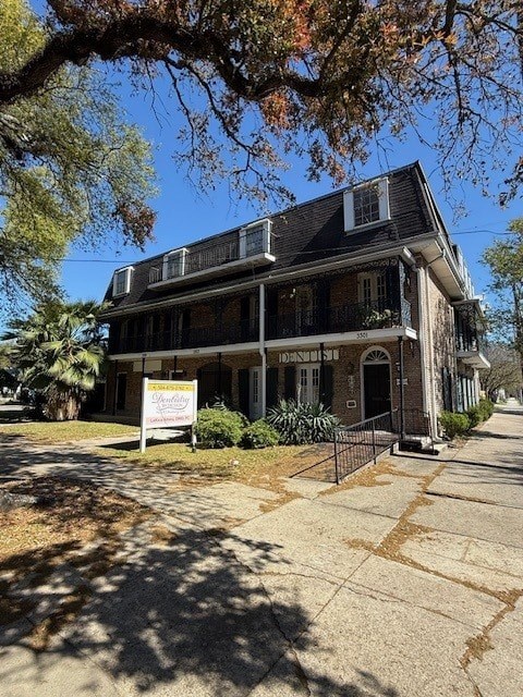 A house with a sign in front of it.