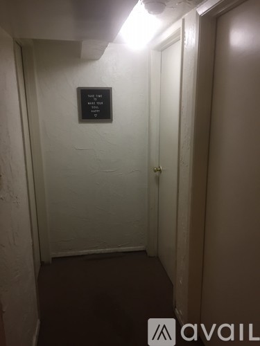 A sign on a wall in a hallway that says "Please do not enter.".