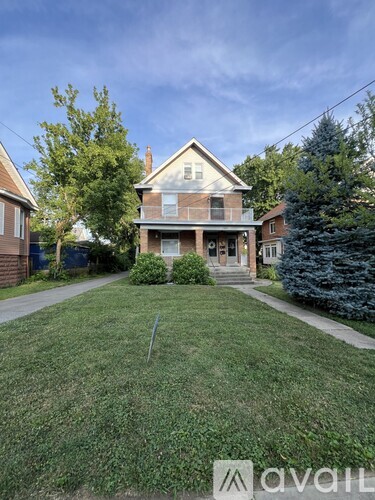 A house with a lawn in front of it.