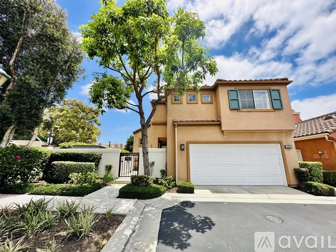 A house with a white garage door is for sale.