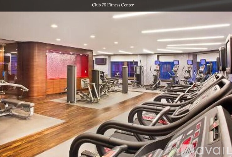A gym with treadmills and other exercise equipment.