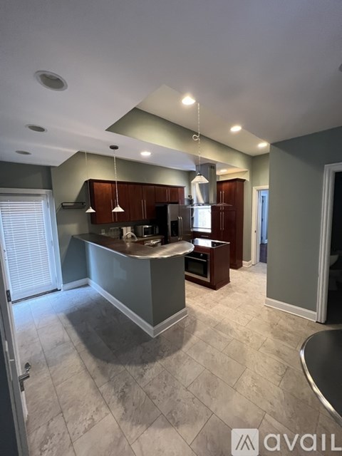 A kitchen with a large island in the middle.
